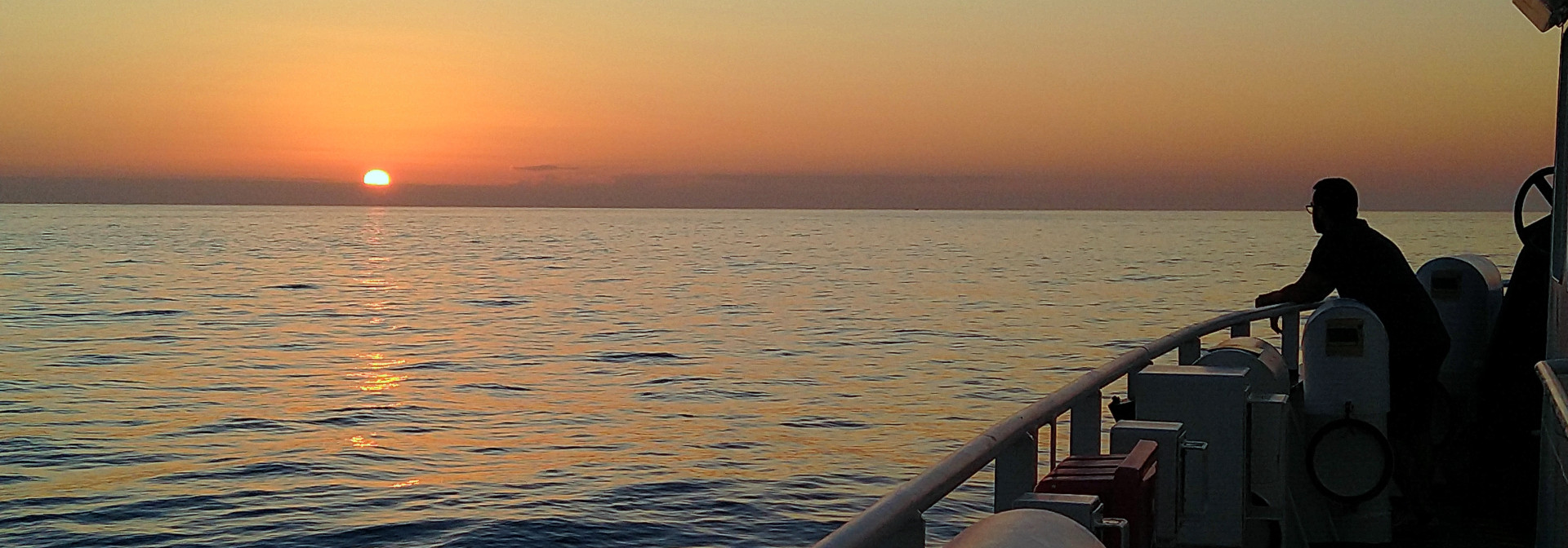 Sunset over Atlantic waters observed from a research vessel.