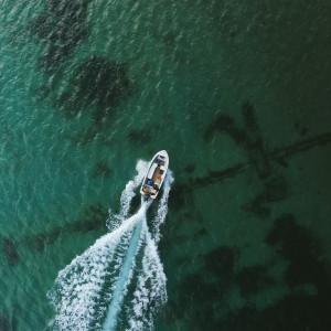 Drone photo of a tourist boat in open ocean