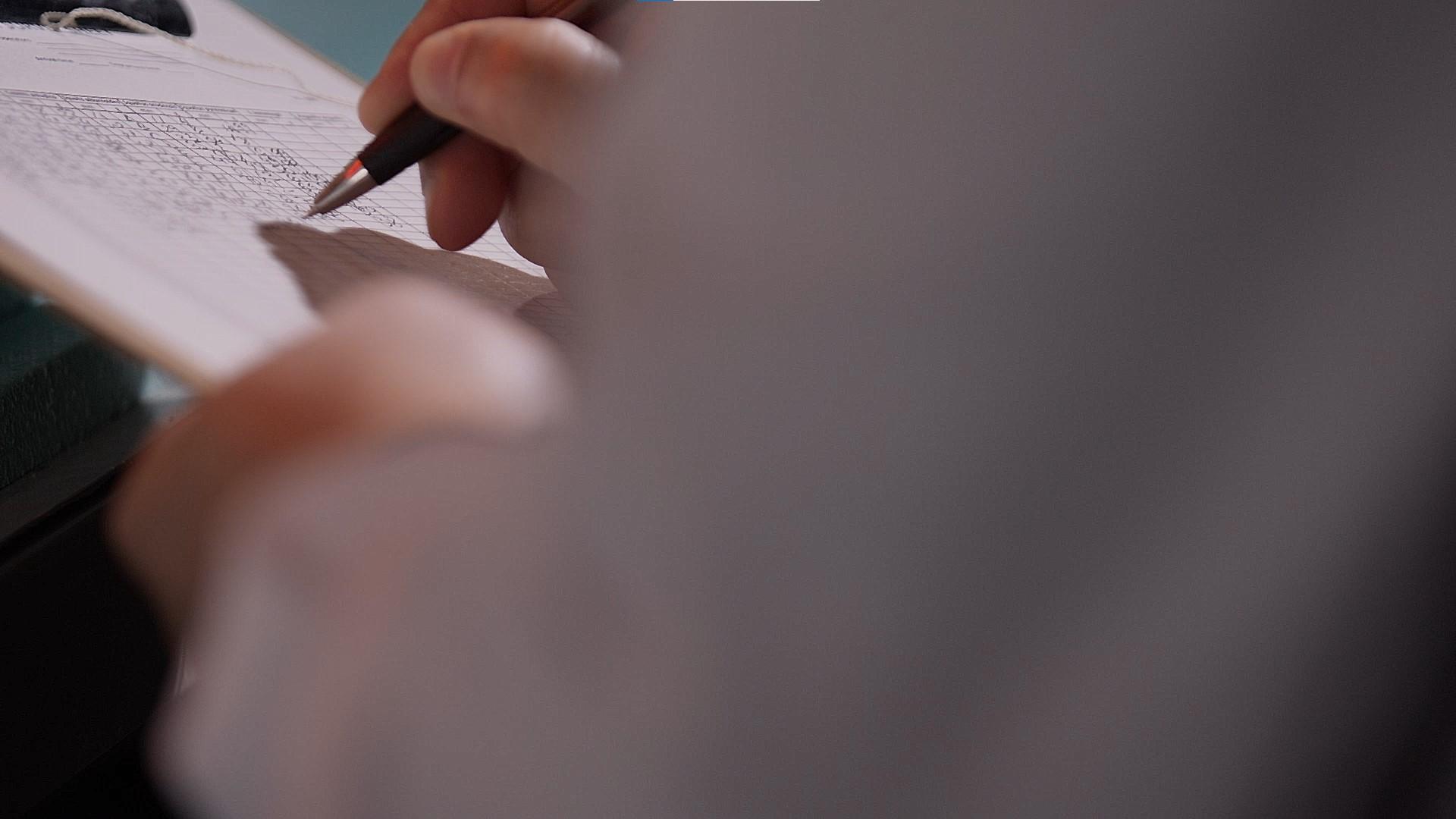 Detail of researcher's hand at work
