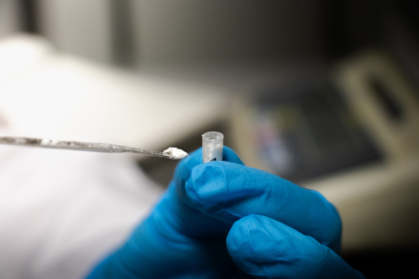 Detail of researcher's hand at work
