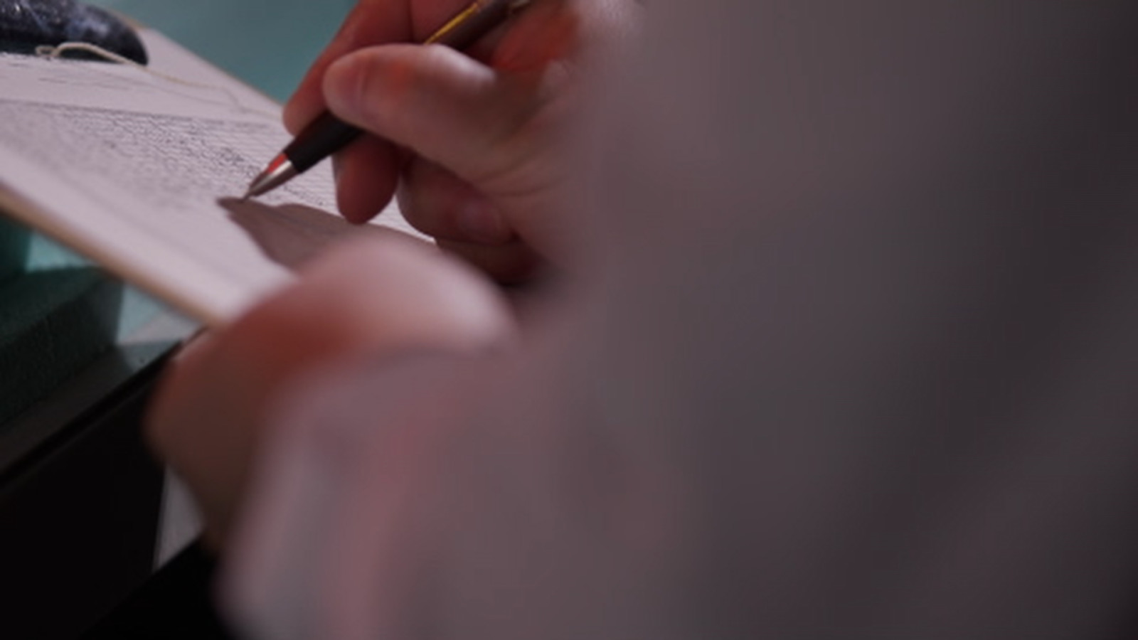 Detail of researcher's hand at work